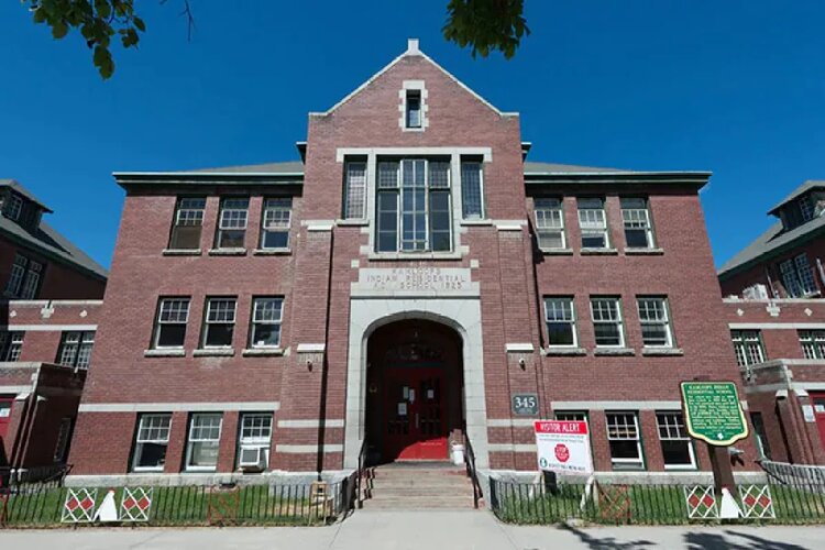 215 bodies found buried in renowned residential school, PM told 'black chapter'