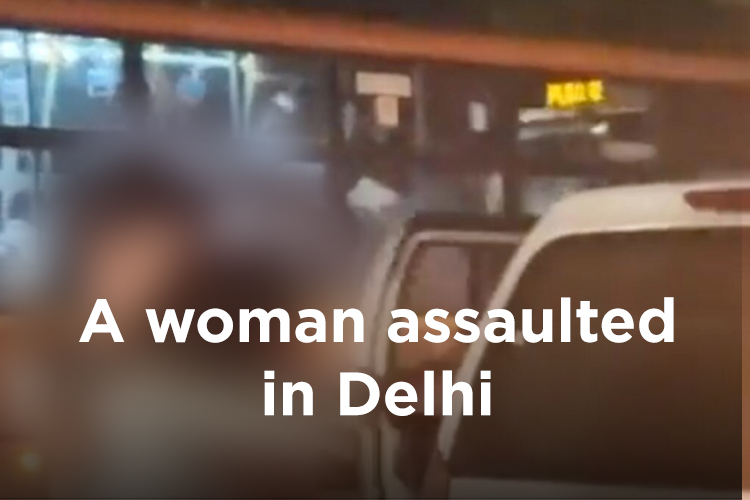 A woman is seen to be assaulted and forcibly pushed into a car on busy road in Delhi